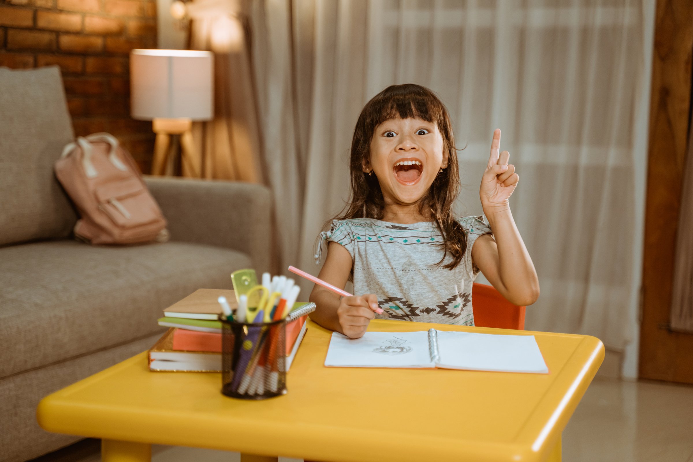 Excited Kid Get an Idea While Studying