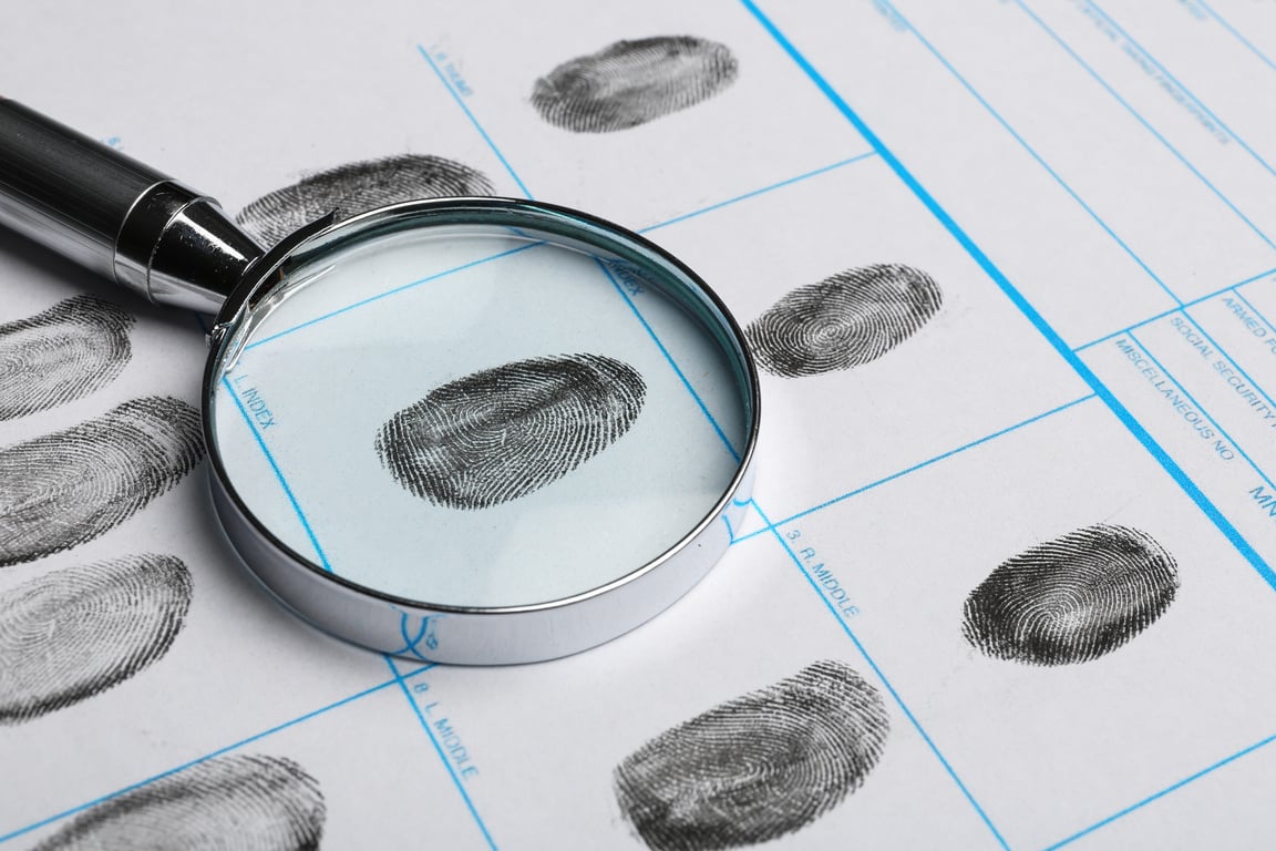 Magnifying Glass and Criminal Fingerprint Card, Closeup