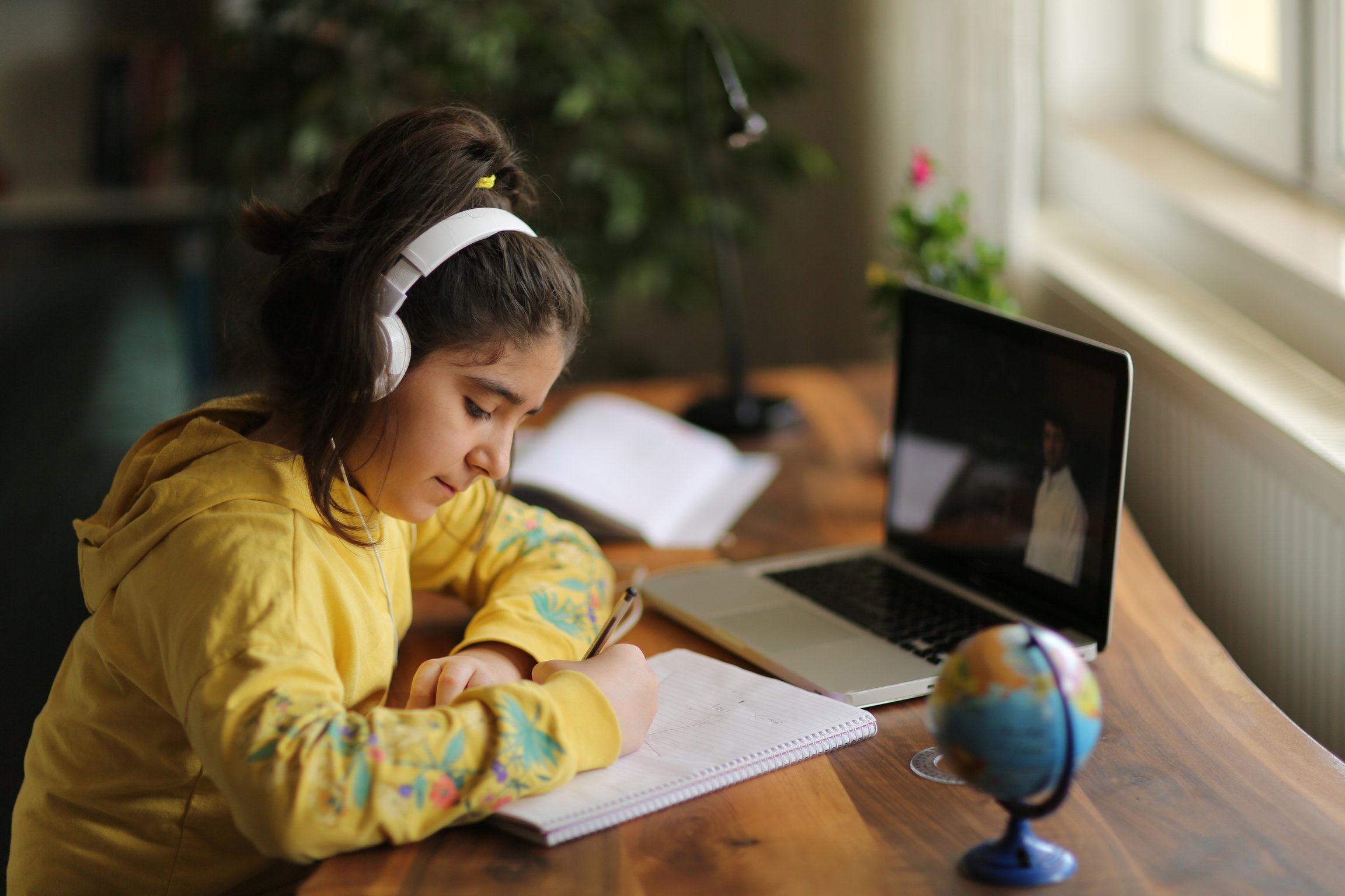 Schoolgirl watching online education class